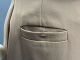 close up of a person ' s pants with a button in the back pocket