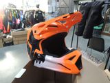 a helmet that is sitting on top of a cardboard box