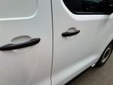 a white van with a black door handle on the side of it