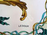 a close up of a plate with a design on it
