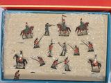 a lot of figurines in a box on the table