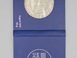 an image of a blue box with a silver coin in it