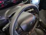 a steering wheel and dashboard of a car in a car showroom
