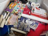 a plastic bag full of books and toys in it
