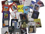 a pile of books that are sitting on a table
