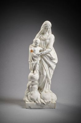an image of a statue of a woman holding a child