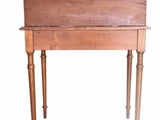 a small wooden table with a drawer on it
