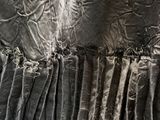 an image of a close up of a dress with a ruffled skirt