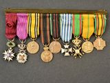 many medals and medals hanging on the wall