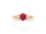 an oval ruby and diamond ring