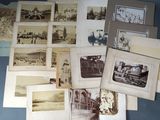 many old photographs of people and buildings on the table