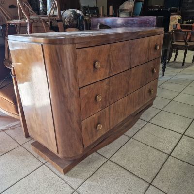 a large wooden dresser in the middle of a room