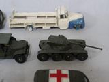 many different toy vehicles that are on a table