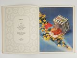 an open book with a picture of a jar and flowers on it