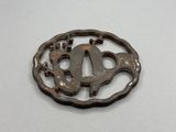 a close up of a metal object on a white surface
