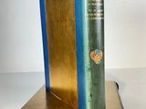 a book that is sitting on top of a book stand