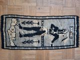 a rug with a picture of a man and a woman on it