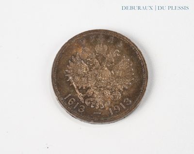 a coin that is sitting on a white surface