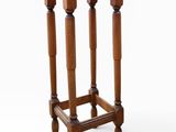 an image of a small wooden table with two legs and a round top