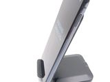 a cell phone that is sitting on top of a stand