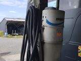 a gas pump attached to the side of a bus