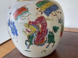 a vase that has a picture of a woman on it