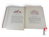 an open book with a drawing of a mountain on it