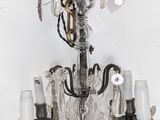 a chandelier that has a bunch of lights hanging from it