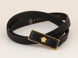 black leather bracelet with a gold plated apple on it