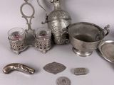 a lot of silver items that are on the table