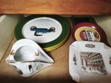 many plates and cups sitting on the counter