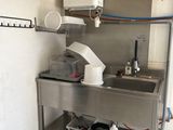 a kitchen with a sink and a refrigerator in it
