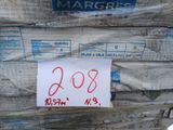 a sign on a stack of pallets with a price tag on it
