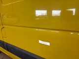a yellow van with a sticker on the side of it