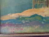 a picture of a painting of a beach scene in a frame