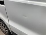 a white van parked on the side of the road