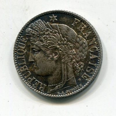 a close up of a coin with a woman ' s head on it