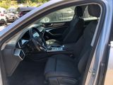 the interior of a car with the door open and the driver ' s seat up