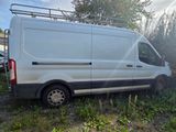 a white van that is parked in the grass