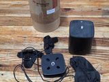 an image of a table with a box, remote, and other items on it