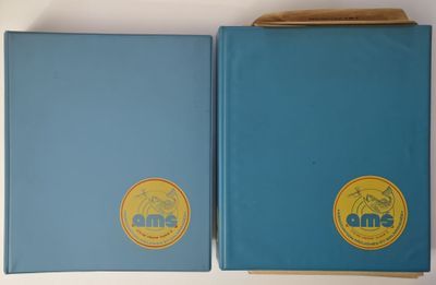 two books are sitting on top of a white table