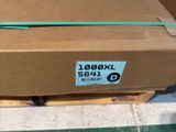 a cardboard box with a green ribbon on top of it