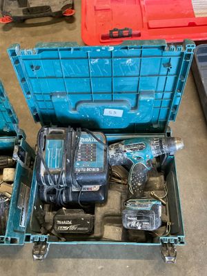 a blue box with tools in it on the floor