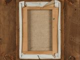 an old picture frame with a picture of a person in it