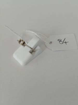 a small white object with a tag attached to it
