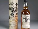 an image of a bottle of whisky next to a cardboard box