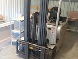 a fork lift truck parked in a warehouse