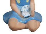 a ceramic figurine of a little girl holding a bunny