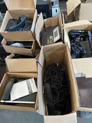 many boxes of electronic equipment sitting on the floor