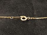 a close up of a gold bracelet on a mannequin mannequin